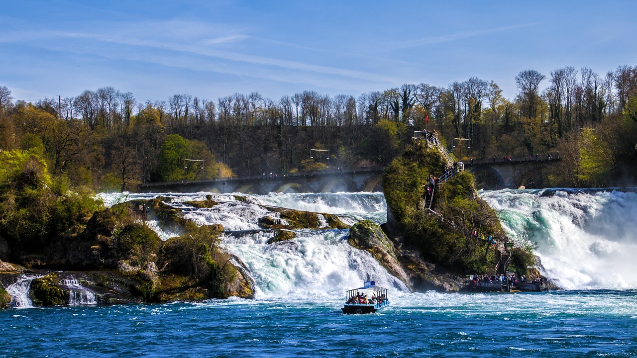 In this image, several individuals are depicted in boats, surrounded by a landscape that includes trees, waterfalls, poles, and a sky.\n
