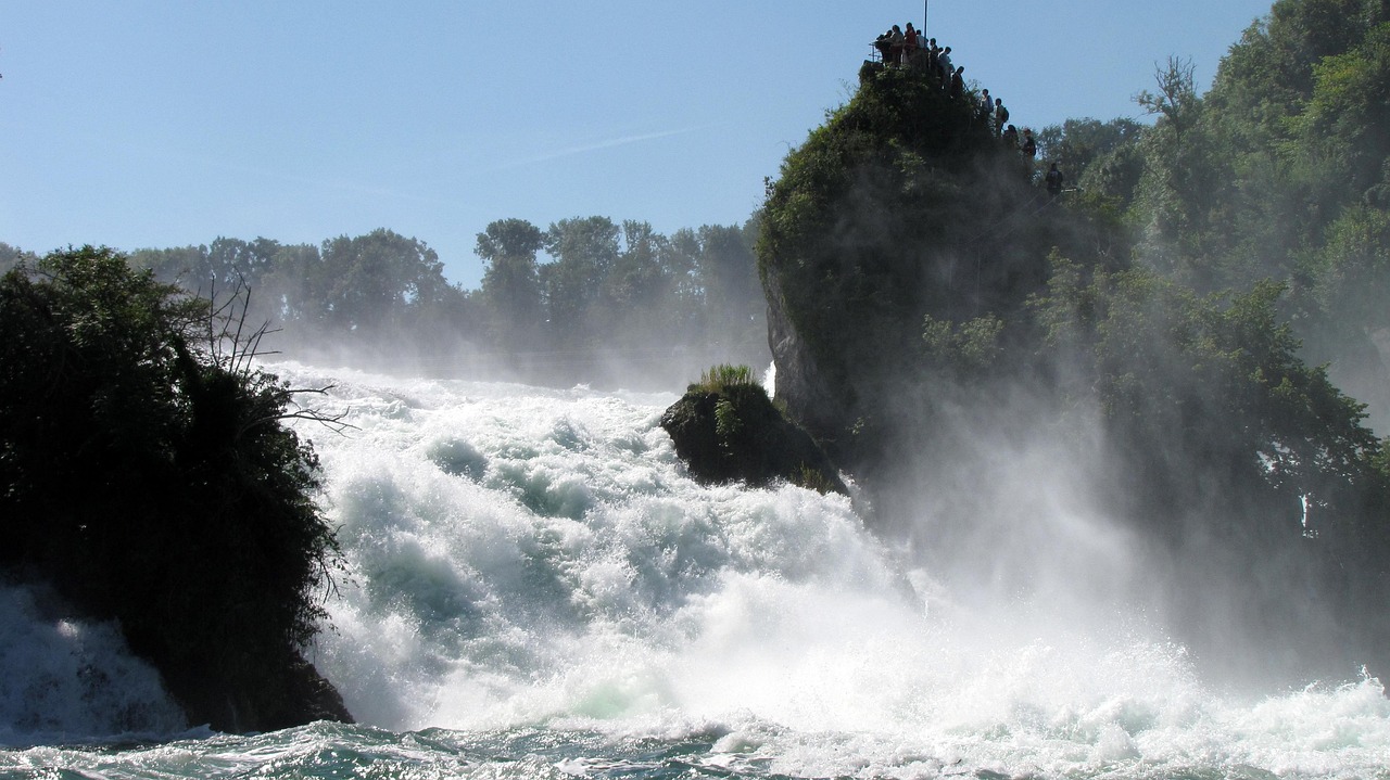 In this image, we observe the presence of water, trees, and the sky.\n
